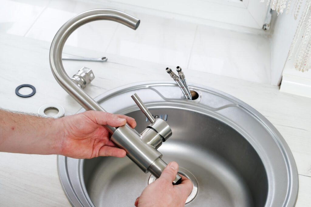 A picture of a new sink head being installed