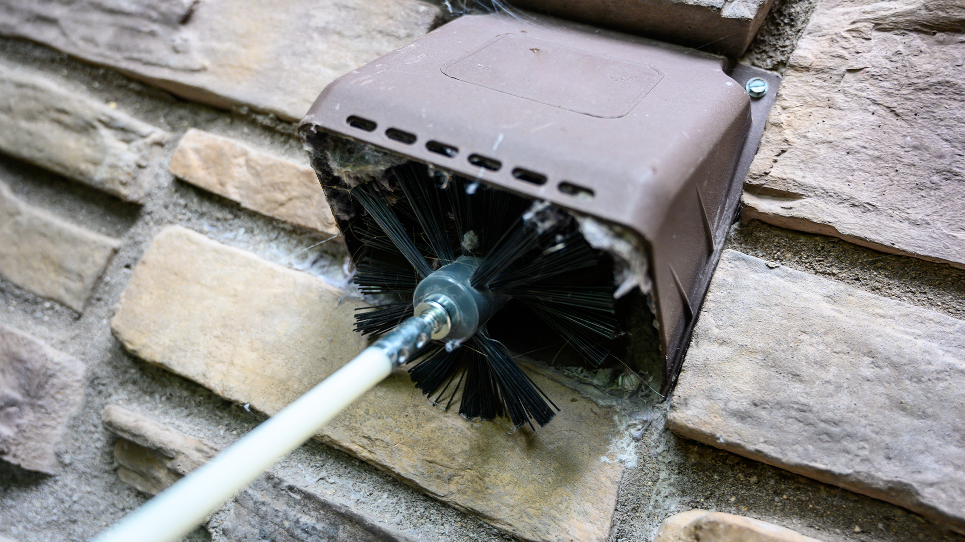 Cleaning AC vent with wire brush