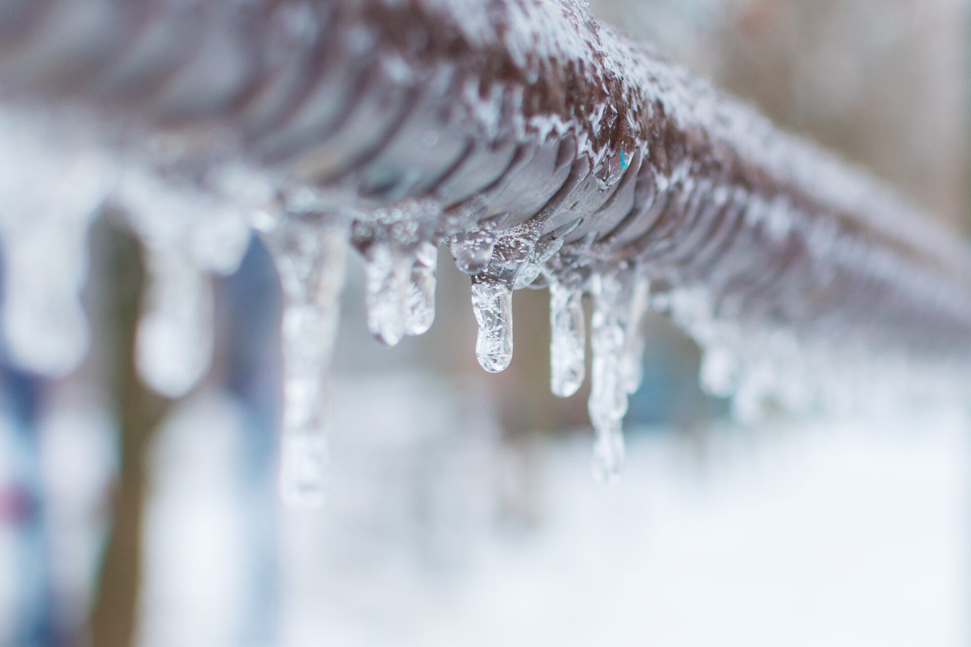 frozen-icicles-after-rain-on-the-pipe